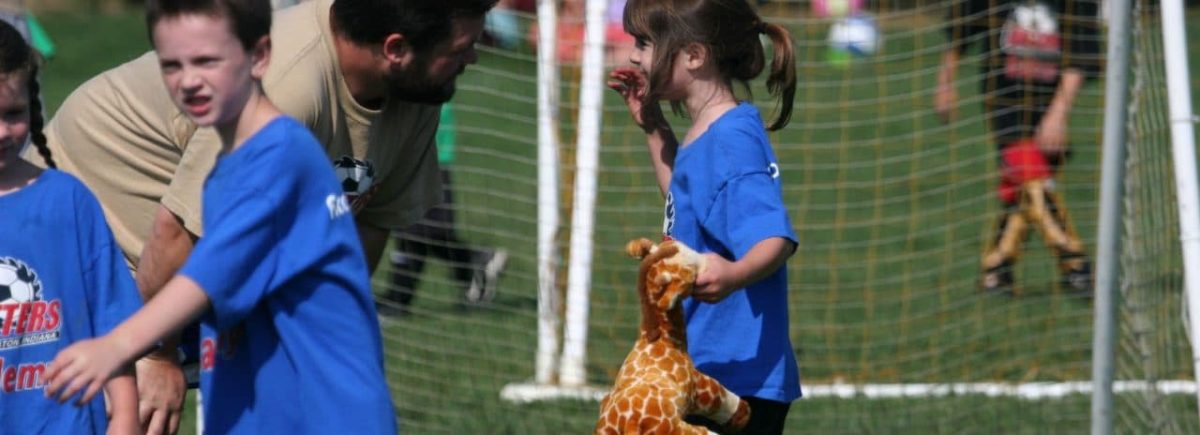 Image of Elkins Apartments sponsored Cutters Community Soccer coach and players